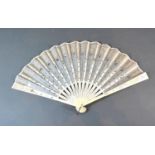 An Ivory and Gauze Leaf Fan with carved ivory sticks and guards and with sequin decorated gauze leaf