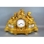 An Early 19th Century French Ormolu Mantle Clock by Raingo Freres Paris, the putti surmount with