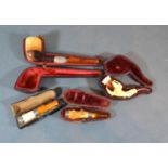 A 19th Century Cheroot within fitted case together with another similar, a cased pipe and a