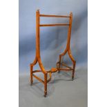 An Edwardian Sheraton Revival Valet Stand with twin end supports and shaped stretcher with brass