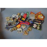 A Collection of Military Cloth Badges and Cap Badges