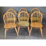 A Set of Six Ercol Blonde Ash Stick Back Dining Chairs comprising two arms and four singles with
