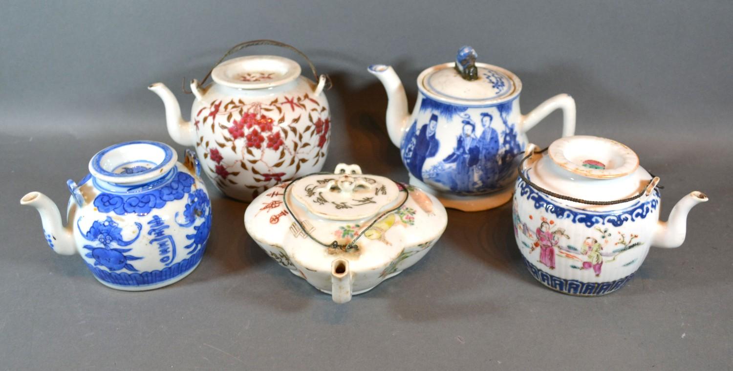 A Canton Teapot Decorated in Polychrome Enamels together with four other similar teapots to