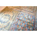 A North West Persian Woollen Rug with a central medallion within an all-over design upon a blue