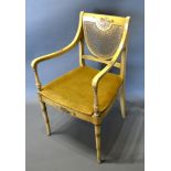 A Regency Painted Armchair, the partly caned back above a similar seat raised upon ring turned