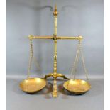 A Set of Brass Balance Scales by Doyle & Sons London, 56 cms tall