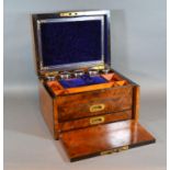 A Victorian Walnut Dressing Case retailed by Cormack Brothers London, the hinged cover enclosing a