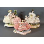 A Dresden Porcelain Group in the form of Three Girls with Crinoline Dresses decorated in