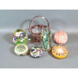 A Millefiori Glass Paperweight together with five other similar glass paperweights and a small glass