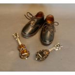 A Pair of 19th Century Child's Handmade Leather Lace Up Shoes with wooden soles with iron hoops