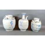 A 19th Century Chinese Wine Vessel decorated in underglaze blue 25cm tall together with another