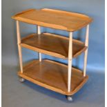 An Ercol Blonde Ash Three Tier Buffet with turned supports, 72 x 46 cms, 74 cms high