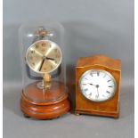 A Bulle electric Clock with Glass Dome and turned wooden stand together with a walnut cased mantle