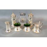 A Pair Of Sheffield Silver Peppers together with a Birmingham Silver four piece condiment set