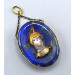 A Late 19th Century Lapis Lazuli Pendant of oval form mounted with a rock crystal figurehead 2.5 x 3