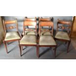 A Set of Four William IV Mahogany Dining Chairs each with a pierced rail back above drop in seat