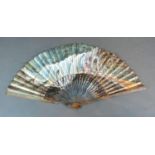 A Mid 18th Century Lined Paper Leaf Fan with serpentine wooden sticks, a hand painted leaf depicting