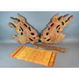 A Pair of Indian Carved Wooden Wall Plaques inset coloured stones together with another similar