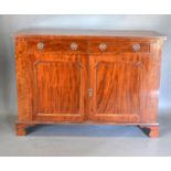 A 19th Century Mahogany Chiffonier with two frieze drawers above two panelled doors, raised upon