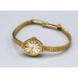 A Rotary 9ct. Gold Cased Ladies Wristwatch with 9ct. Gold Strap, 11.3 gms excluding movement