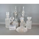 A Pair Of Cut Glass Decanters together with a cut glass ships decanter and three other glass