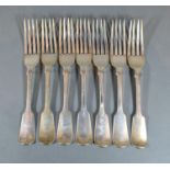 A Set of Seven Victorian Silver Table Forks by George Adams with fiddle pattern handles, dates