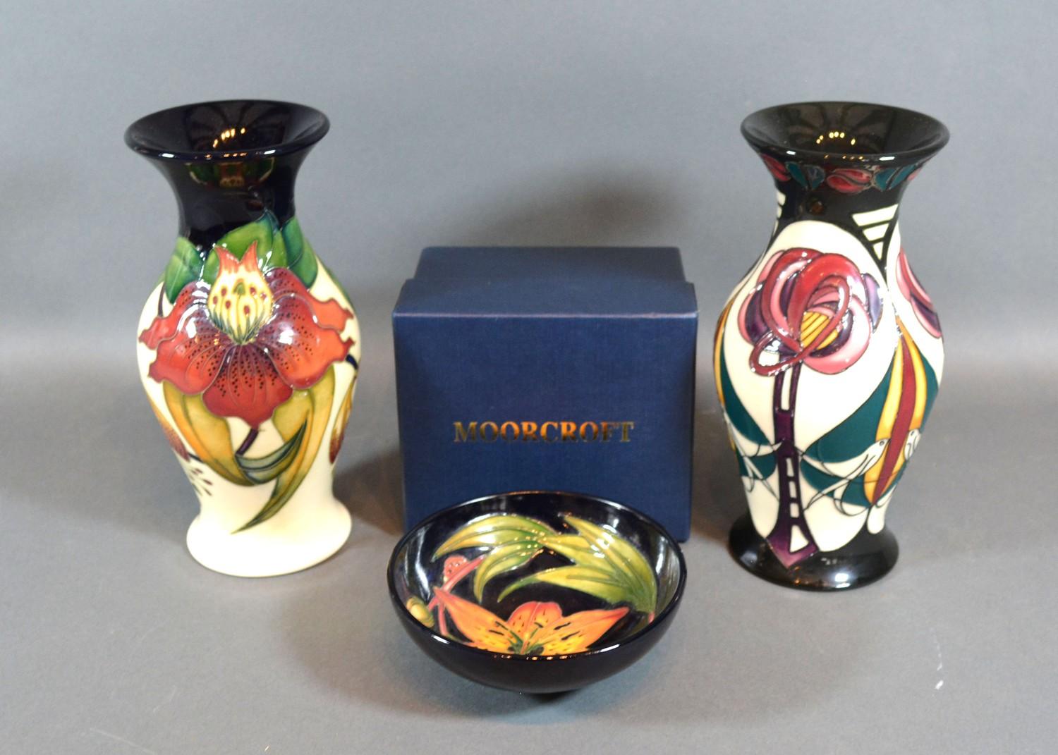 A Moorcroft Oviform Vase, tube lined, Anna Lily pattern 19.5 cms tall together with another