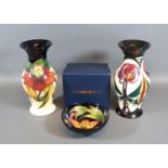 A Moorcroft Oviform Vase, tube lined, Anna Lily pattern 19.5 cms tall together with another