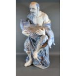 A Chinese Porcelain Underglaze Blue Decorated Figure Holding a Carp 68cm tall