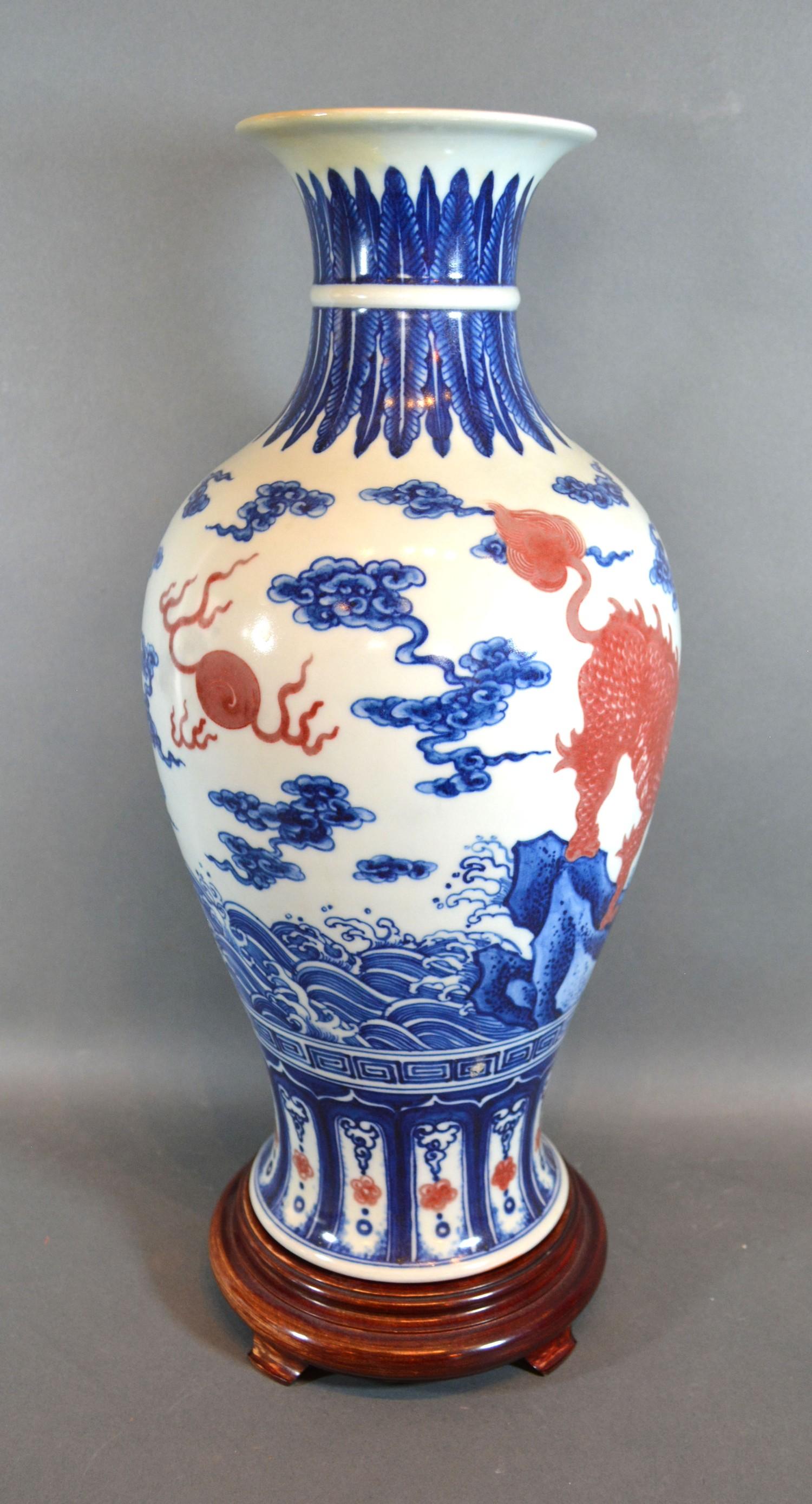 A Chinese Porcelain Oviform Vase decorated with iron red Fu dogs with underglaze blue six - Image 3 of 6