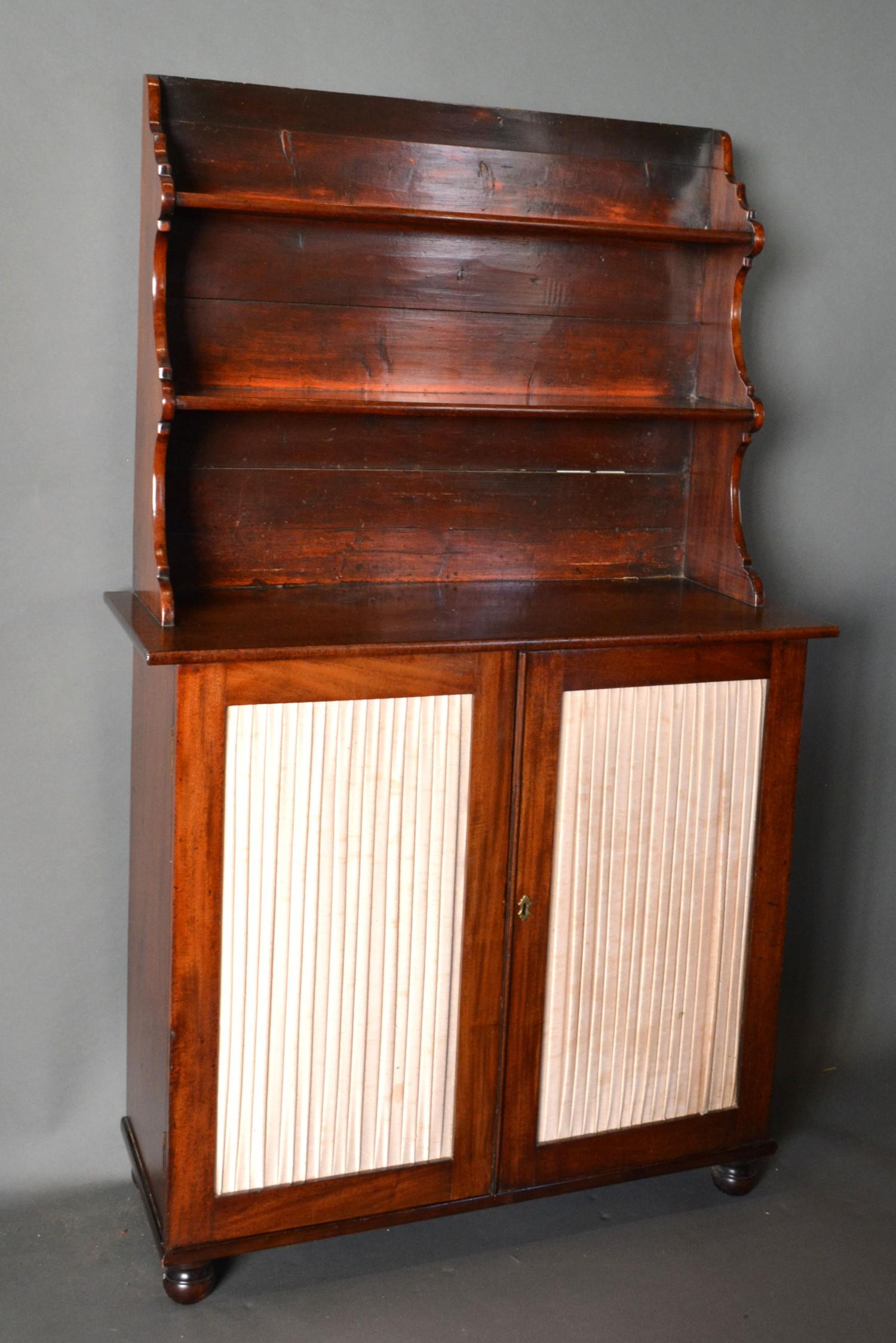 A 19th Century Mahogany Chiffonier, the boarded shelf back above a lower section with two fabric