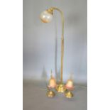 A Pair of Brass Adjustable Table Lamps together with a similar brass adjustable lamp standard