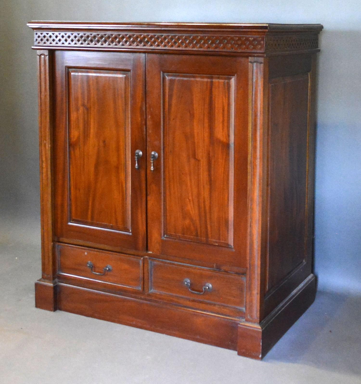 A 20th Century Hardwood Side Cabinet with two panel doors above two drawers raised upon a plinth - Image 2 of 2