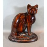 A Late 19th Century Treacle Glazed Pottery Model of a Cat from the former Canney Hill Pottery near