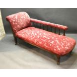 A Victorian Chaise Longe with scroll end and spindle back raised upon turned tapering legs with