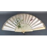 A Hand Decorated Satin Leaf Fan decorated with hummingbird and flowers, with ivory sticks and bone