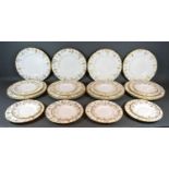 A Set of Twelve Royal Crown Derby Vine Pattern Dinner Plates together with twelve smaller plates and