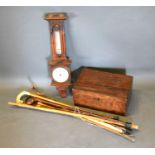 A Collection of Walking Canes, a parasol, a barometer thermometer and a 19th century mahogany work