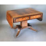 A Regency Rosewood Brass Inlaid Sofa Table, the two frieze drawers opposed by dummy drawers with