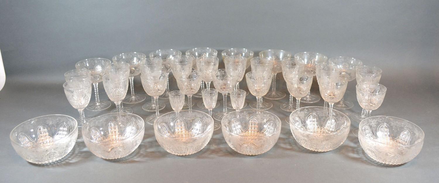 A Cut Glass Drinking Set comprising eight champagne glasses, various other glasses and six finger