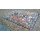 A North West Persian Style Woollen Rug with a triple centre medallion within an all over design upon