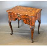 A Late 18th or Early 19th Century Dutch Marquetry Lowboy, the shaped top above three drawers with