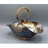 Christopher Dresser for Hukin and Heath, a Silver Plated Basket of shaped form with handle