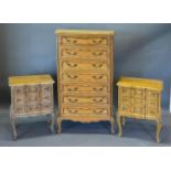 A 20th Century French Chest of Seven Drawers together with a pair of matching three drawer bedside