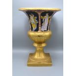 A Paris Porcelain Style Urn, hand painted with classical figures upon a black and gilded ground with