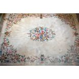 A Large Chinese Woollen Carpet with a foliate design upon a cream ground, 374 x 278 cms