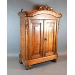 A French Table Cabinet in the form of an Armoire, the carved and moulded cornice above two panel