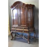 A Late 18th or early 19th Century Dutch Mahogany Cabinet on Stand, the moulded cornice above two