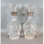 A Pair of Cut Glass Decanters with Stoppers each with a silver collar