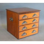 A 19th Century Collectors Chest of four drawers with cup handles and side handles, 44 cms wide, 40